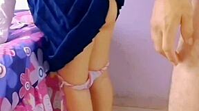 horny students fuck in the living room with family around.