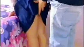 horny students fuck in the living room with family around.