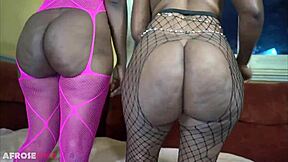 Two ebony women dance with fantastic booties