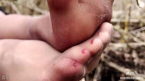 Goddess in spring forest teases you with feet in tan pantyhose.