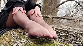 Goddess in spring forest teases you with feet in tan pantyhose.