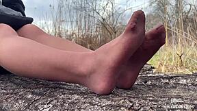 Goddess in spring forest teases you with feet in tan pantyhose.