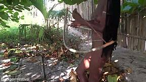 Hey, check this naked skinny tribe woman crafting a bow for her next hunting trip