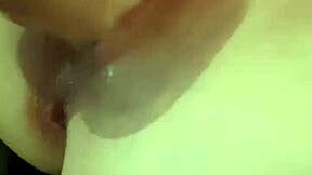 My girlfriend is having fun with her dildo and friend.