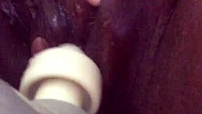 squirting ebony on the sofa with intense masturbation