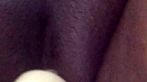 squirting ebony on the sofa with intense masturbation