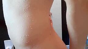 Muscular handsome man's shower time with cute brunette in solo masturbation