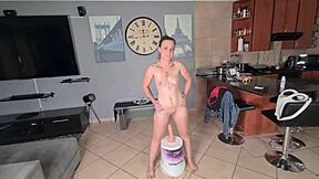 Squatting on dildo until legs burn in close-up.