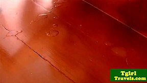 Asian ladyboy whispers, 'Watch me tug my cock here'