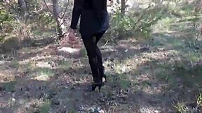 milf struts powerfully in pantyhose and high heels, showcasing her big ass