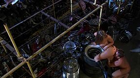 Avy Scott bent over in heels for mechanic's cum on shaved pussy