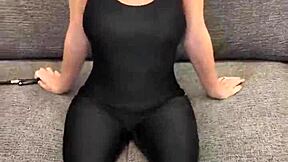 Model Poses In Black Bodysuit And Hunter Boots.