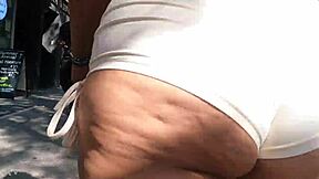 walking in public with mini shorts, flashing my ass to voyeurs