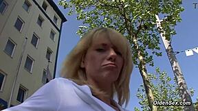 German Blonde MILF Masturbates Shaved Pussy On Casting Couch.