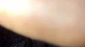 Black woman enjoys solo relaxation with wet elements in homemade session