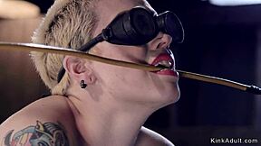 Blonde slave in gas mask gagged and choked in bondage