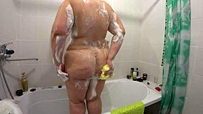 Big ass milf shakes while chubby lesbian cums in bathroom