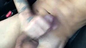she's giving herself a massage while masturbating in the car during the day
