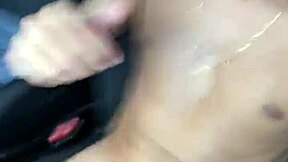 she's giving herself a massage while masturbating in the car during the day