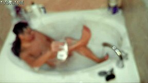 solo bubble bathing boy in the bathroom