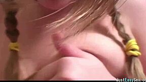 pigtailed brunette teases big tits