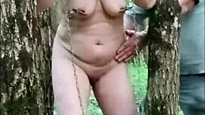 hey, check out this housewife slave getting trained in the forest with sodomy, urine play, and a mouth cumshot