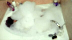 solo bubble bathing boy in the bathroom