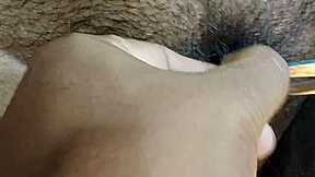 Desi bhabi meticulously cleans her hairy pussy.