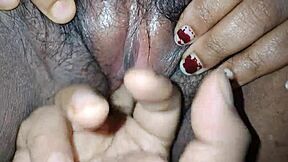 Desi bhabi meticulously cleans her hairy pussy.