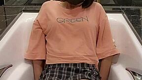 Shemale ting xuan takes a bath in the bathtub wearing clothes