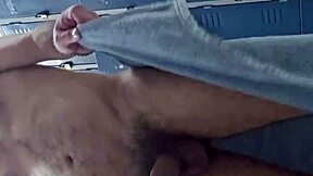guy masturbates his big cock in the gym bathroom solo
