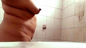 Watch this curvy big-tits milf shower and exhibit herself!