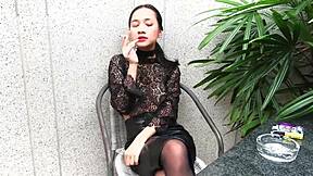 Young Girl Feels Thrilled Smoking Topless In Leather Skirt