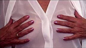 Naughty granny in see-through top and slip teasing and flashing