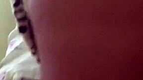 A couple shares a romantic good morning kiss early in the day