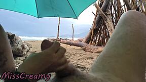Public sex in storm with misscreamy handjobs on cock at beach