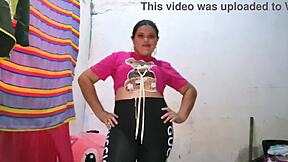 The blonde Latina in a pink blouse models while licking and sucking