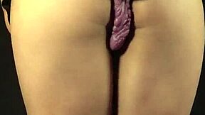 In this intense scene, the hot pussy gets fucked by a big purple dildo, leading to a loud moaning orgasm for Xattlalust.