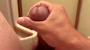 Japanese amateur engages in solo masturbation, pleasuring her shaved pussy intimately