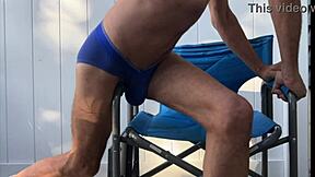 Deep pelvic stretching in blue briefs on blue chair late october 2024