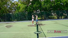 Melanie Monroe Oliver catches the ball on the tennis court