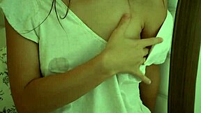 Intense close-up of brunette amateur milking lactating tits.