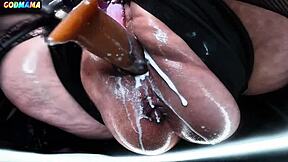 Your horny mature godmama stretches her hairy wet cunt with dildo in garage