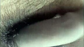 Horny desi girl gives footjob while using vibrator on bed