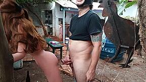 Ruiva showing off her ass with sex toys outdoors