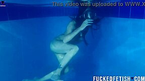 Helen Star Dives Underwater In Pool With Mask