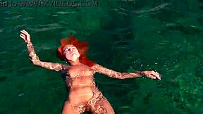 Blue water surrounds the naked girl in this public exhibition