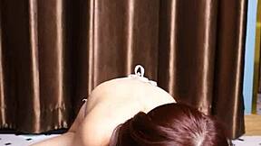 April Maxima sucks a dildo before giving it a footjob