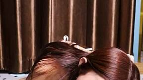 April Maxima sucks a dildo before giving it a footjob