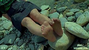 goddess in tan nylons show her cute nylon soles and toes on the riverside